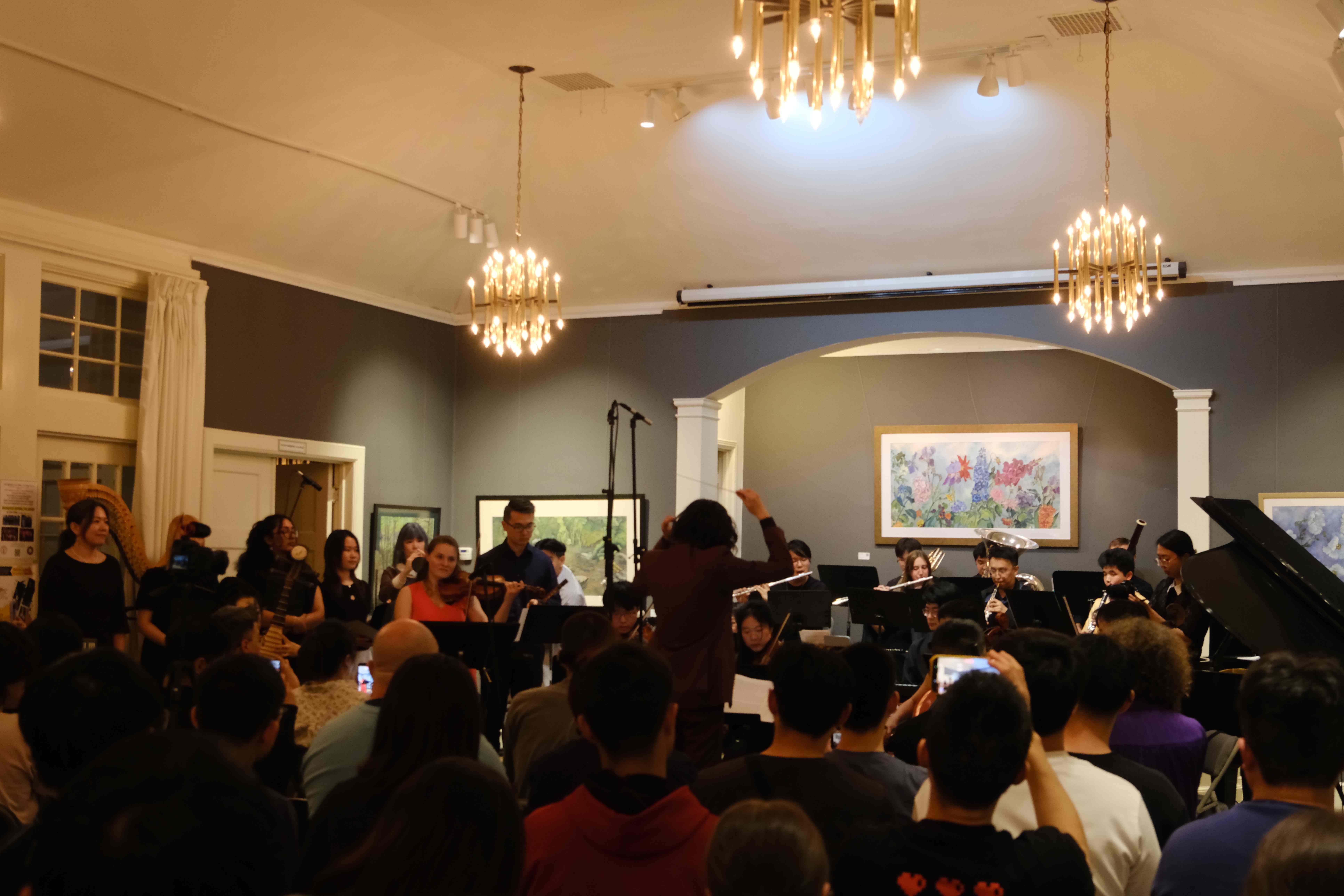 Full orchestra performing with conductor at Piedmont Center for the Arts debut concert